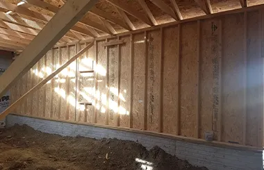 Interior view of garage addition framing and foundation work in Omaha by Liberty Contractors