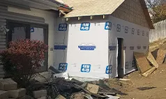 Home in Gretna prepared for new siding with weather-resistant house wrap