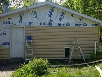 Vinyl siding installation in progress on residential home in Elkhorn Nebraska