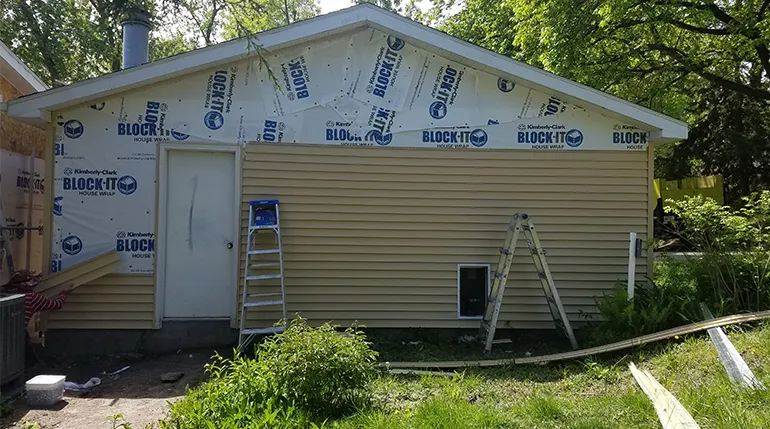Vinyl siding installation in progress on residential home in Elkhorn Nebraska
