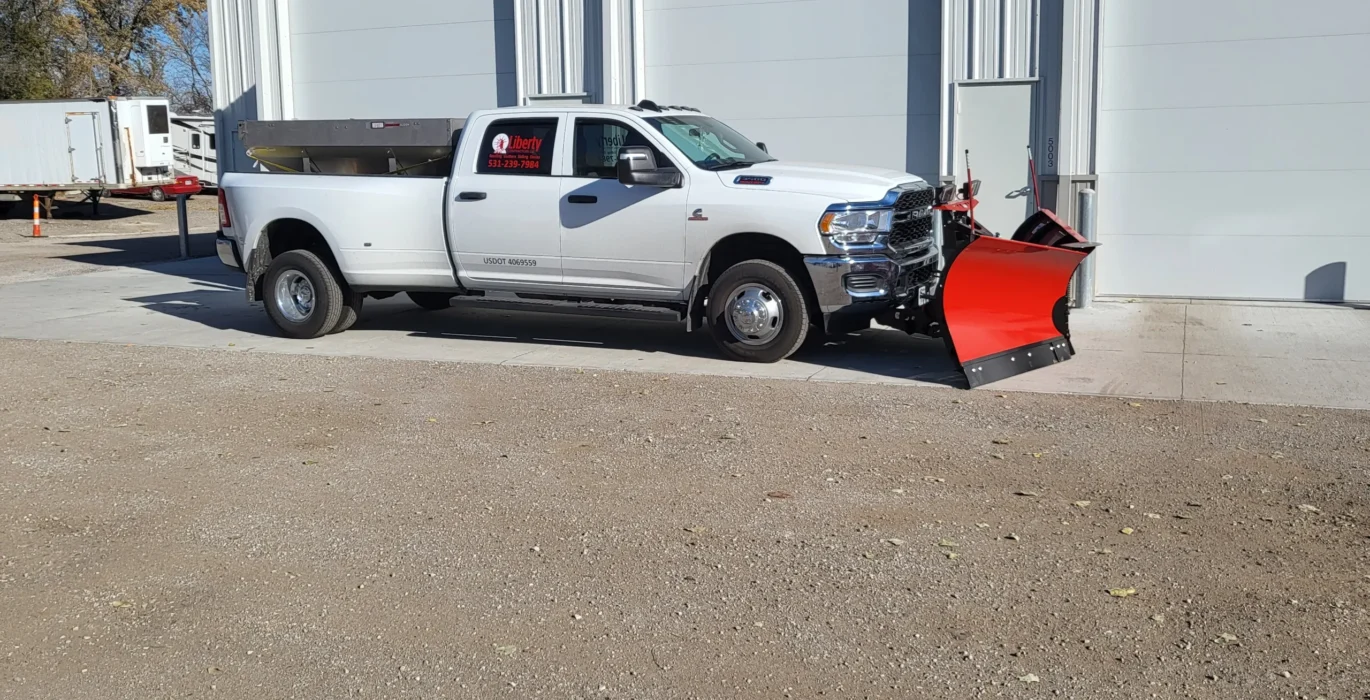 Liberty Contractors truck equipped with plow blade parked outside Omaha facility for snow removal omaha services.
