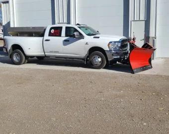 Liberty Contractors truck equipped with plow blade parked outside Omaha facility for snow removal omaha services.