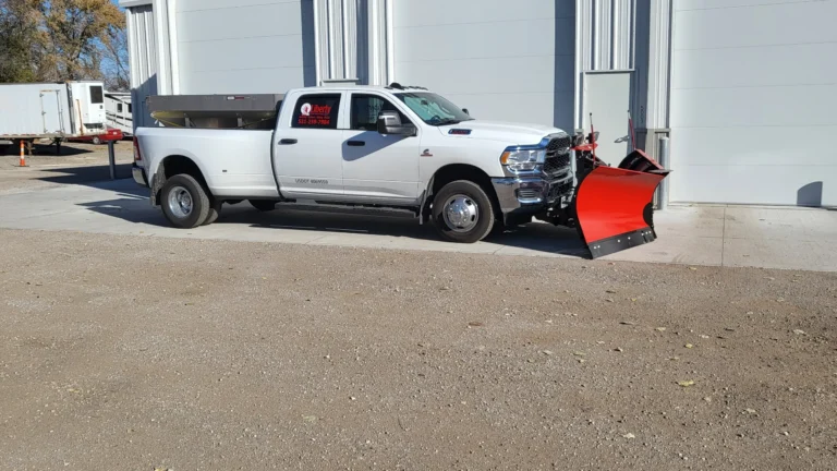 Liberty Contractors truck equipped with plow blade parked outside Omaha facility for snow removal omaha services.