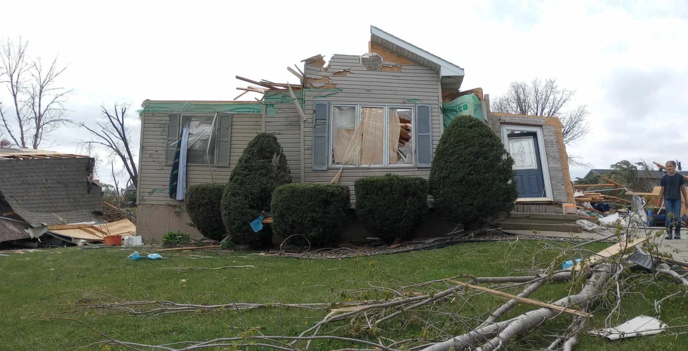 Severe storm damage roof repair Omaha reference photo of a tornado struck house in Minden Iowa Insurance claim mistakes omaha