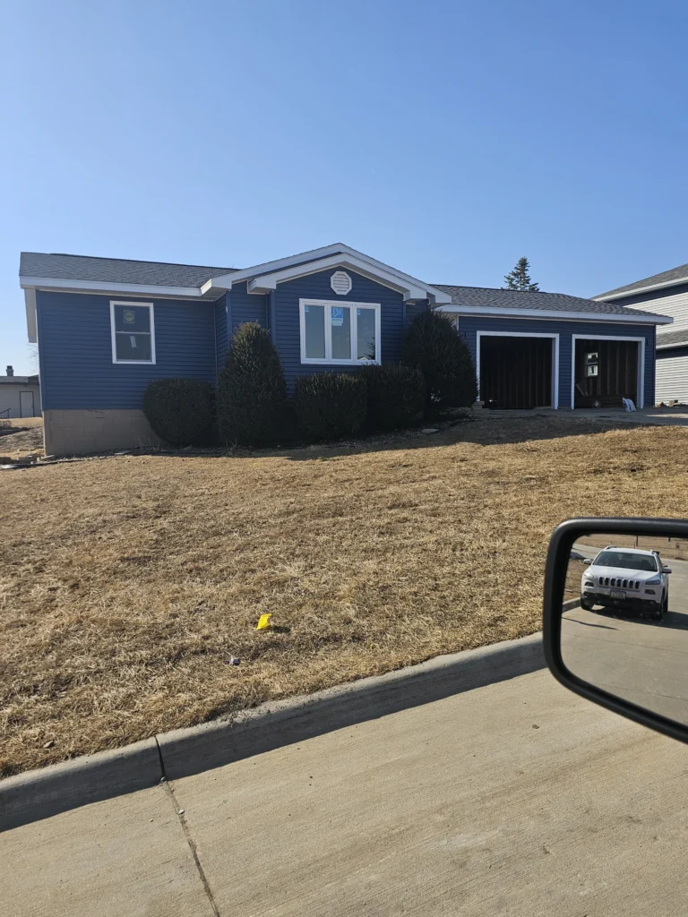 Home in recovery after storm damage contractor near me completed repairs on a hail damaged Nebraska property